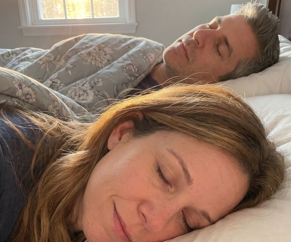 Morning: same bed, she sleeps peacefully with no earplug, he sleeps quietly
