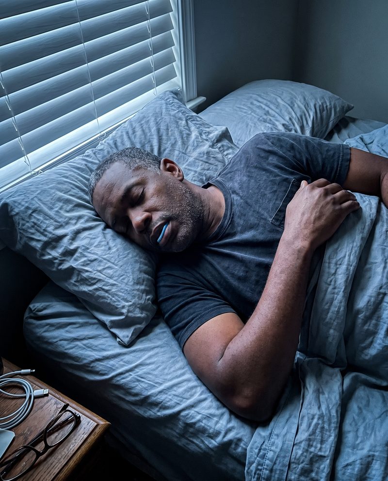 A husband asleep in the morning with it still in